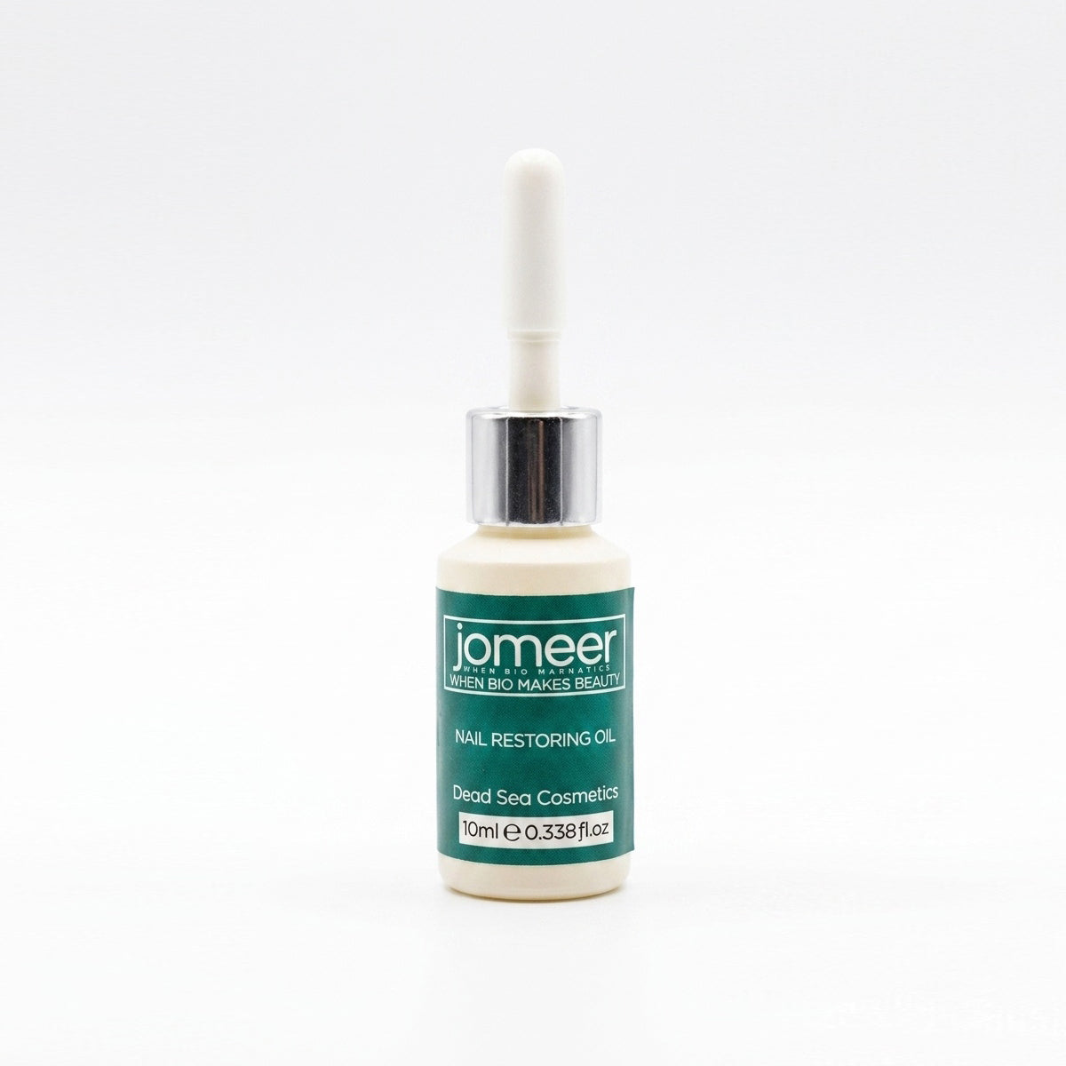 Bottle of jomeer nail restoring oil on a white background